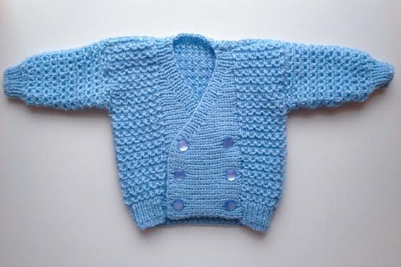 this itty bitty double breasted hand-knit sweater is quite possibly the cutest thing I've ever laid eyes on. I can hardly wait to see it on baby Graham!